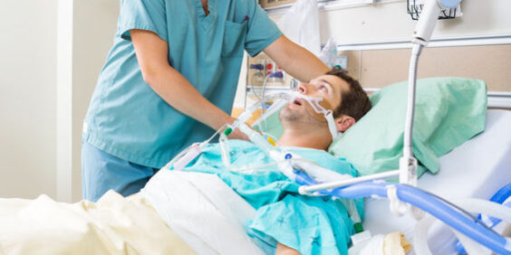 Nurse Adjusting Patient’s Pillow