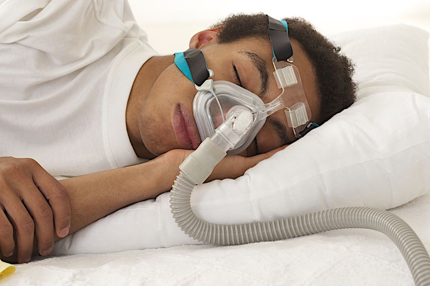 29925451 Young Mulatto Man Sleeping With Apnea And Cpap Machine
